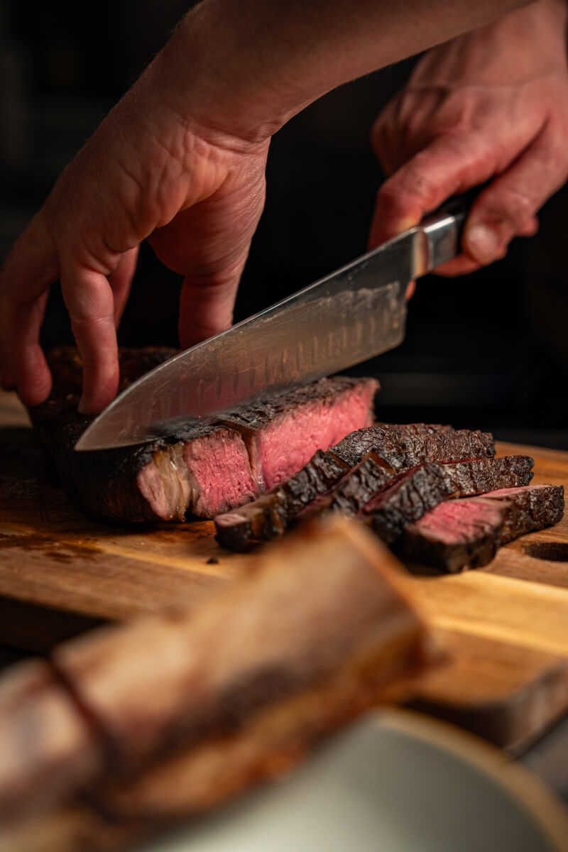 Head Chef James Cutting Up A Steak